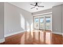Bright living room with hardwood floors and access to a private balcony at 222 Glenwood Ave # 508, Raleigh, NC 27603