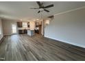 Spacious living room with hardwood floors and an open concept kitchen at 35 Diamond Creek Dr, Zebulon, NC 27597