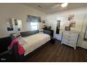 Bedroom with a daybed, dresser, and hardwood floors at 283 Pump Station Rd, Erwin, NC 28339