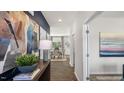 Bright and airy foyer with hardwood floors and stylish decor at 385 Swift Creek Farm Ln, Clayton, NC 27520