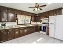 Classic kitchen with wood cabinets, granite countertops, and tiled floor at 1132 Arbor Ln, Rocky Mount, NC 27803