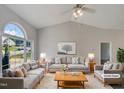 Virtually staged living room with gray couches and a coffee table at 6849 Coventry Ridge Rd, Raleigh, NC 27616