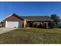 Brick ranch home with a two-car garage at 106 D'Ango Cir, Angier, NC 27501