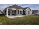 Covered patio and grassy backyard at 1724 Red Elm Lane, Homesite 76, Fuquay Varina, NC 27526