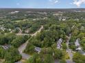 Wide shot of a residential area, showcasing tree-lined streets and houses at 414 Englewood Dr, Chapel Hill, NC 27514