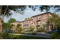 Side view of brick building, landscaping, and parking at 2606 Marchmont St # 101, Raleigh, NC 27608
