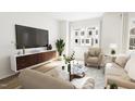Spacious living room with comfortable seating and large TV at 710 Portia Way, Homesite 12, Morrisville, NC 27560