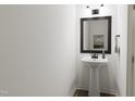 Small powder room with pedestal sink and modern fixtures at 710 Portia Way, Homesite 12, Morrisville, NC 27560