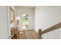Bright entryway with hardwood floors and console table at 712 Portia Way, Homesite 11, Morrisville, NC 27560