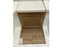 Kitchen design with brown cabinets, quartz countertops, and wood-look flooring at 9228 Leaning Post Rd # 445, Wake Forest, NC 27587