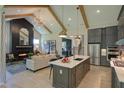Open concept kitchen and living room with vaulted ceiling at 1565 Bowers Store Rd, Siler City, NC 27344