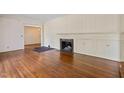 Living room with hardwood floors and a fireplace at 2445 Pineway Dr, Burlington, NC 27215