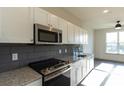 Modern kitchen with stainless steel appliances and granite countertops at 2326 Gathering Sq Ct, Fuquay Varina, NC 27526