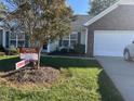 Brick ranch home with attached garage, yard and For Sale sign at 3016 Old Craig Trail, Mebane, NC 27302