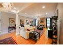 Open living room with hardwood floors, fireplace and ample natural light at 8104 Last Oak Ct, Raleigh, NC 27613