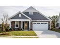 Two-story house with yellow front door, white garage, and manicured lawn at 1230 Linkwood, Homesite 44, Fuquay Varina, NC 27526