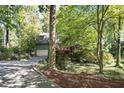 Charming home nestled among lush greenery and trees at 403 Rutherglen Dr, Cary, NC 27511