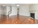 Living room with hardwood floors, fireplace and staircase at 517 Birchrun Dr, Durham, NC 27712