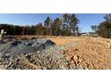 Empty lot with groundwork and piles of gravel at 2434 Englemann Dr # 355, New Hill, NC 27562