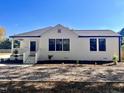 Newly renovated white brick home with front porch at 1011 Lemon Dr, Durham, NC 27705