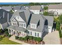 Stunning two-story home with a large backyard and attached garage at 117 Hardy Oaks Way, Holly Springs, NC 27540