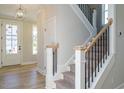 Bright entryway with hardwood floors and staircase at 6045 Scalybark Road, Durham, NC 27712