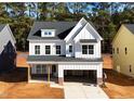 Two-story white house with gray roof and attached garage at 3317 Oakfields Rd # 5, New Hill, NC 27562