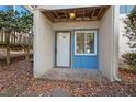 Private entrance with white door and a small window at 7040 Longstreet Dr # C, Raleigh, NC 27615