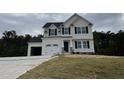 Two story home with a two car garage and landscaping at 726 Sherrill Farm Dr, Benson, NC 27504