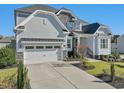 Two-story house with stone accents, landscaping, and a two-car garage at 2105 White Rocks Rd, Wake Forest, NC 27587