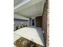 Covered patio perfect for relaxing and entertaining at 124 Swain St, Clayton, NC 27527
