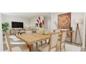 Bright dining area with wood table and six chairs at 52 Kidderminster Ct, Zebulon, NC 27597