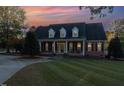 Brick home with front porch, and nicely landscaped yard at 166 Weldon Dr, Clayton, NC 27520