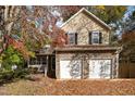 Two-story house with stone and siding exterior at 1412 Hanford Hills Rd, Graham, NC 27253