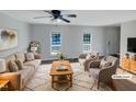 Virtually staged living room features neutral walls, hardwood floors, and ample natural light at 3181 Hardie St, Creedmoor, NC 27522
