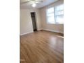 Bright bedroom featuring wood-look flooring at 327 Ranch Farm Rd, Raleigh, NC 27603
