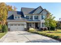 Two story house with stone accents and landscaping at 5356 Cypress Ln, Raleigh, NC 27609