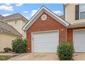 Attached garage with white door, located in a townhome community at 2633 Vega Ct, Raleigh, NC 27614