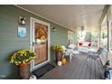Inviting front porch with rocking chairs and autumnal decorations at 7925 S Highway 55, Willow Springs, NC 27592