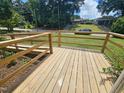 Wooden deck with railings, offering outdoor space at 805 Newcombe Rd, Raleigh, NC 27610