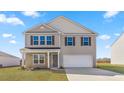 Two-story home with stone accents and a two-car garage at 317 Leven Dr, Gibsonville, NC 27249