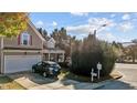 Two-story house exterior with taupe siding, attached garage, and driveway at 2125 Star Sapphire Dr, Raleigh, NC 27610