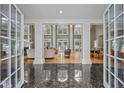 Two-story foyer with marble floors and views to living room and dining area at 90118 Hoey, Chapel Hill, NC 27517
