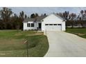 White house exterior with a two-car garage and driveway at 378 Magnolia Run Way, Benson, NC 27504