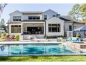 Luxury home with a large pool, patio, and outdoor kitchen at 017 Bartley Holleman Rd # 17, New Hill, NC 27562
