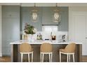 Modern kitchen with light cabinets and an island at 2606 Marchmont St # 102, Raleigh, NC 27608