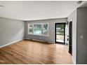 Bright living room with hardwood floors and neutral walls at 1526 Clermont Rd, Durham, NC 27713
