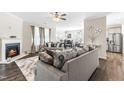 Open living room with fireplace and access to kitchen at 52 E Piston Pt, Clayton, NC 27520