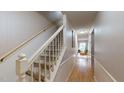 Interior view of a carpeted staircase with wooden railing at 3158 Morningside Dr, Raleigh, NC 27607