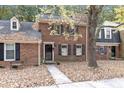 Brick townhome with walkway, surrounded by trees at 3158 Morningside Dr, Raleigh, NC 27607